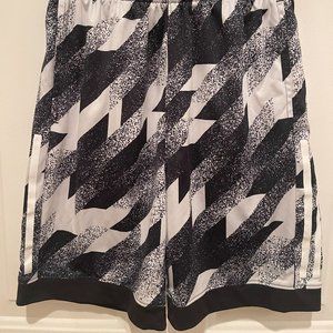 Adidas Navy Blue and White shorts with White stripes.